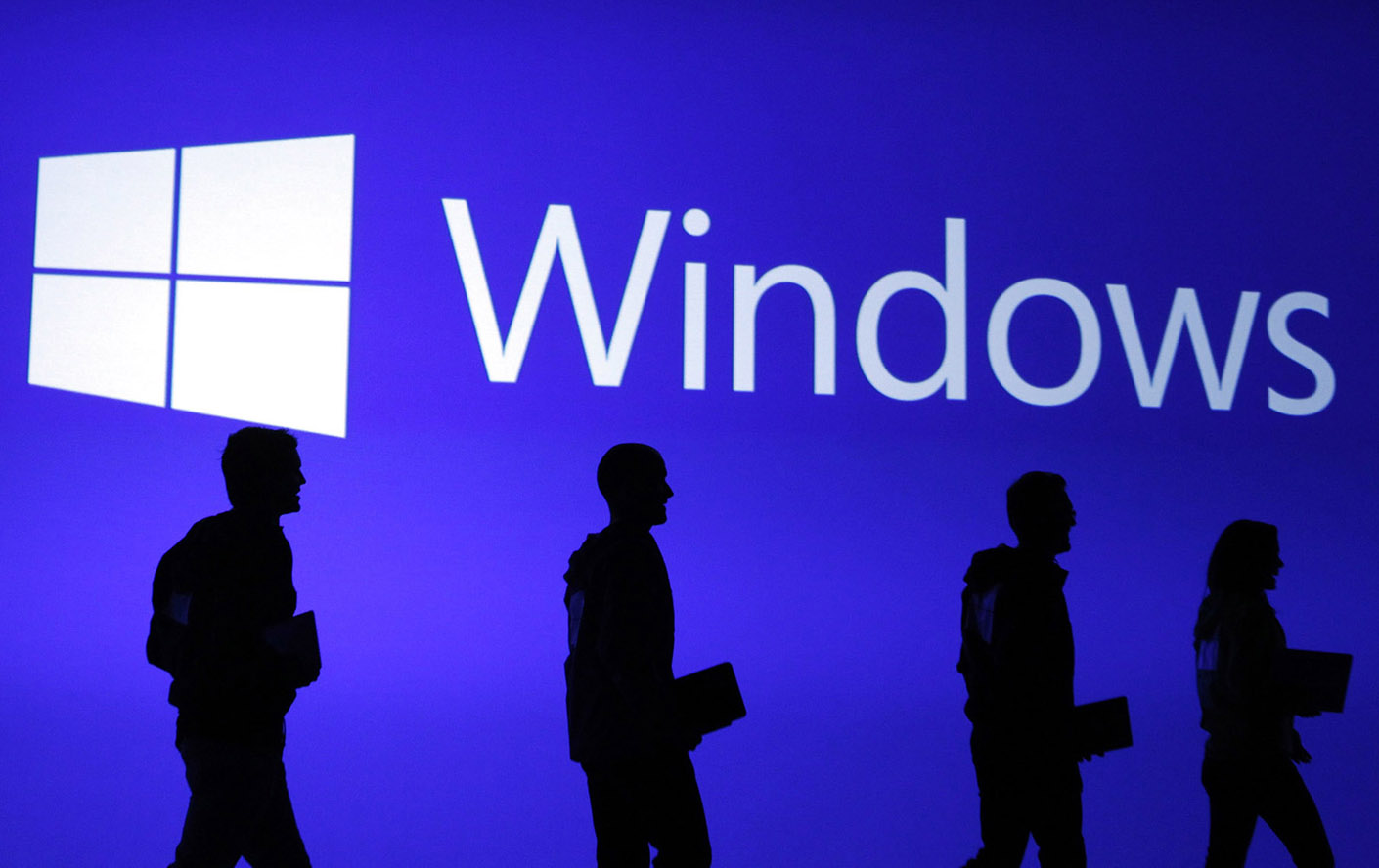 File photo of guests silhouetted at  the launch event of Microsoft Windows 8 operating system in New York